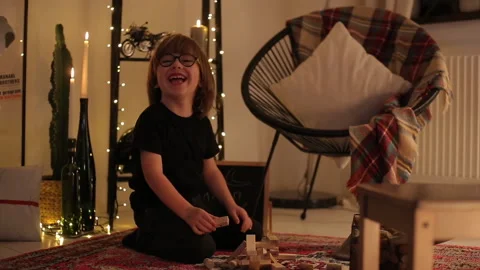 Smart Boy Plays Jenga Tower On Carpet Christmas Decoration Stock Footage 145335934