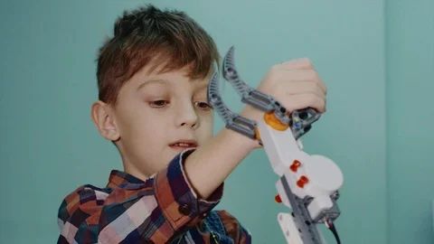 Smart boy with robotic claw. Stock-Footage 92948513