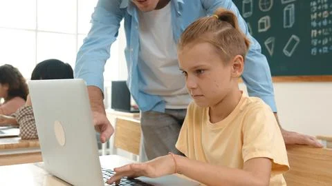 Smart boy using laptop to generated AI by coding engineering prompt. Pedagogy. Stock Photos