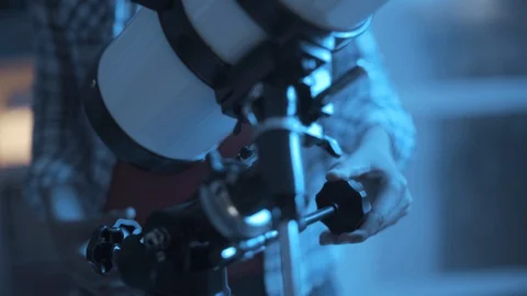 Smart boy using a telescope and learning astronomy Stock Footage 128500982