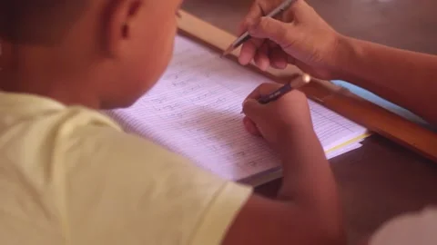 Smart Boy writing on his notebook Stock Footage 243254552