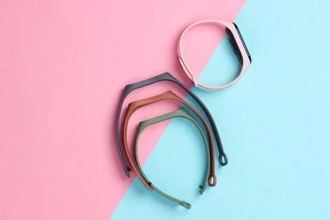 Smart bracelet with interchangeable straps on pink pastel background. Modern  Stock Photos