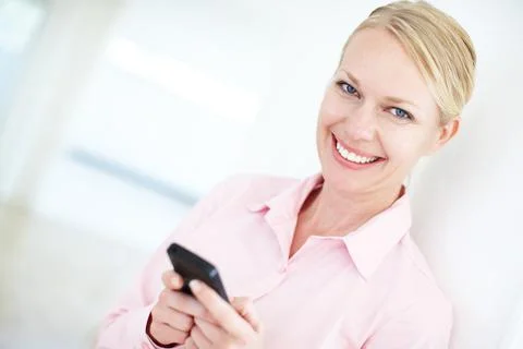 Smart business communications. Closeup portrait of an attractive blond Stock Photos