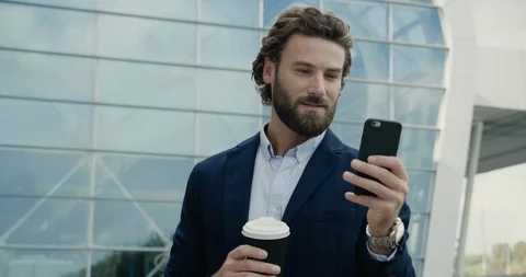 Smart casual dressed Office Worker is drinking Coffe at the Break.  Vídeo Stock 117688884