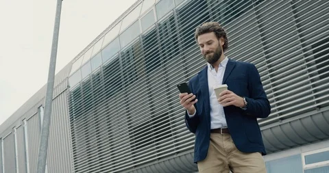 Smart casual dressed Office Worker is drinking Coffe at the Break. Attractive Video stock 117690417