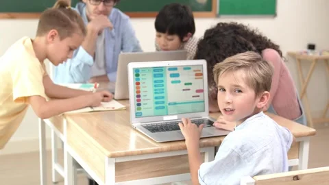 Smart caucasian boy turn around and looking at camera in STEM class. Pedagogy. Stock Footage 269124060
