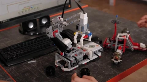 Smart children makes a robot from the robotic constructor in school of robotics. Stock Footage 142011930