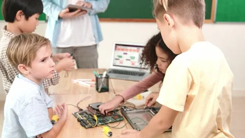 Smart children working on electronic board while teacher using tablet. Pedagogy. Stock Footage 271730817