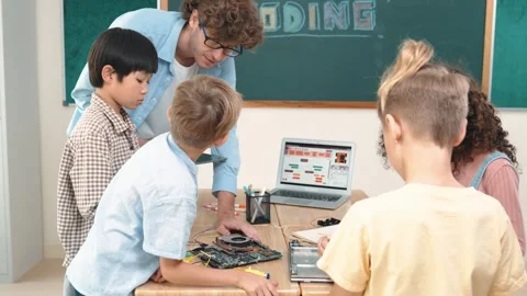 Smart children working on electronic board while teacher using tablet. Pedagogy. Stock Footage 273735878