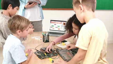 Smart children working on electronic board while teacher using tablet. Pedagogy. Stock Footage 277912063