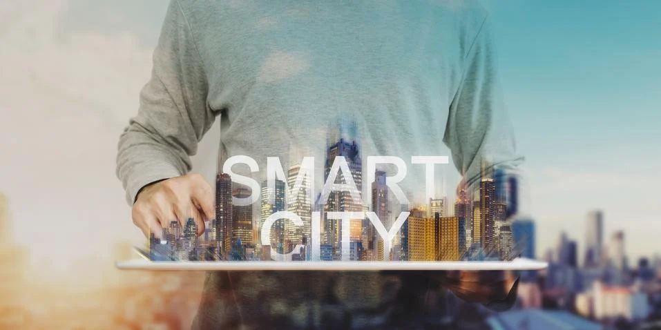 Smart city technology, a man using digital tablet, and modern buildings hologram Stock Photos