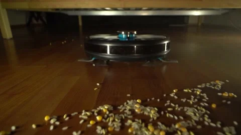 Smart cleaning robot comes out from under the bed and cleans Video stock 181066152