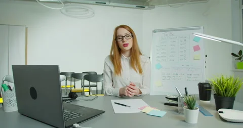 Smart conducts language classes online. Intelligence famale teacher points on Stock Footage 148342135
