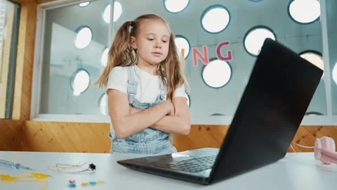 Smart cute girl using laptop programing software while crossing arms. Erudition. Stock Footage 275618403