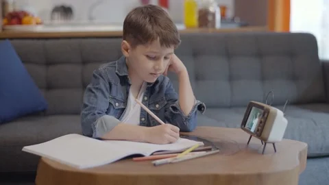 Smart cute little student using phone apps online education. Stock Footage 148981410