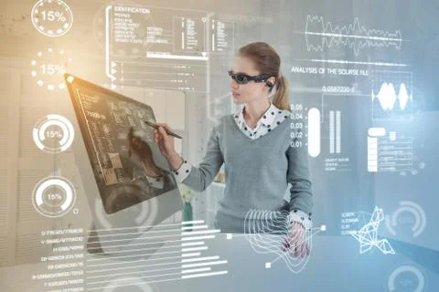 Smart database administrator wearing virtual reality glasses while working Stock Photos