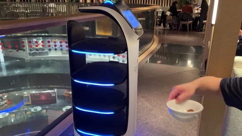 Smart Dining: Robot Waiter Collects Plates at Buffet Restaurant Video stock 304029726