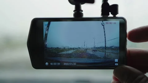 Smart driver checking video recorder in the car before driving. Stock Footage 234062252