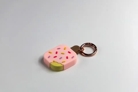Smart Elago Bluetooth tracker in ice cream design for keys, kids, and personal Stock Photos