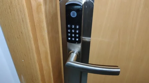 Smart electronic lock unlocking a door Stock Footage 342348152