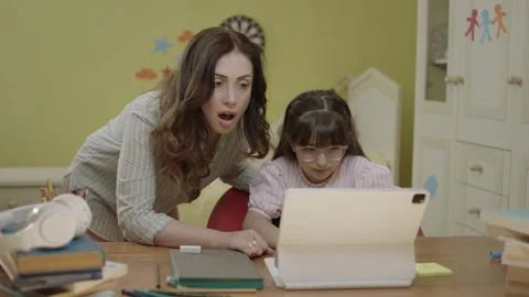 Smart elementary school girl doing math homework with tablet computer Stock Footage 203830705