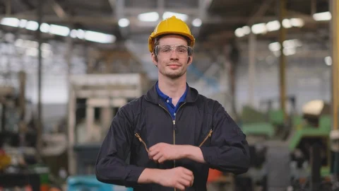 Smart engineer or technician stand in factory and action of confident thumbs up Stock Footage 129142640