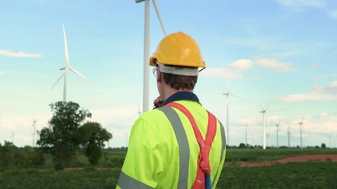A smart engineer with protective helmet on head, using walkie talkie at ele.. Stock Footage 269099263