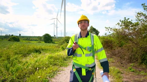 A smart engineer with protective helmet on head, using walkie talkie at ele.. Stock Footage 269099433
