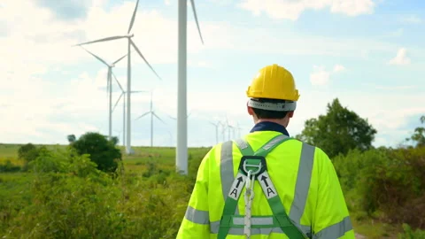 A smart engineer with protective helmet on head, using walkie talkie at ele.. Stock Footage 269099489