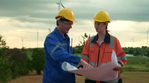 Smart engineer with protective helmet holding the blueprint working at elec.. Stock Footage 269101568