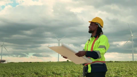 Smart engineer with protective helmet holding the blueprint working at elec.. Stock Footage 269101802