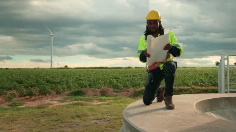 Smart engineer with protective helmet holding the blueprint working at elec.. Stock Footage 269101862
