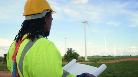 Smart engineer with protective helmet holding the blueprint working at elec.. Stock Footage 269101944