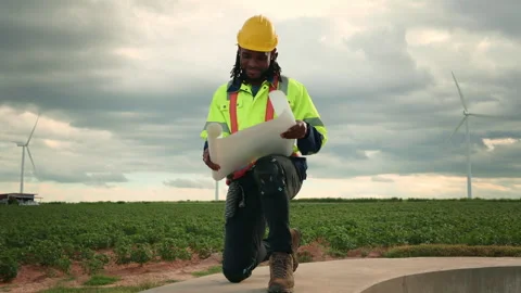 Smart engineer with protective helmet holding the blueprint working at elec.. Stock Footage 269101954