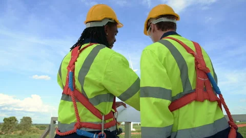 Smart engineer with protective helmet holding the blueprint working at elec.. Stock Footage 269102263