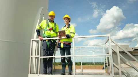 Smart engineer with protective helmet holding the blueprint working at elec.. Stock Footage 269102264