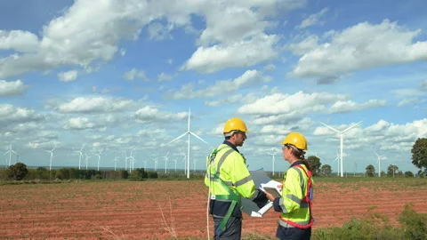 Smart engineer with protective helmet holding the blueprint working at elec.. Stock Footage 269102266
