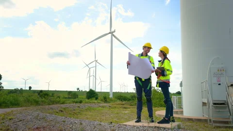 Smart engineer with protective helmet holding the blueprint working at elec.. Stock Footage 269102306