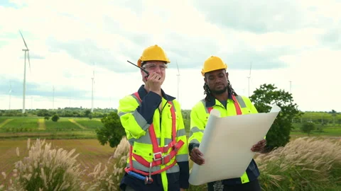 Smart engineer with protective helmet holding the blueprint working at elec.. Stock Footage 269102657