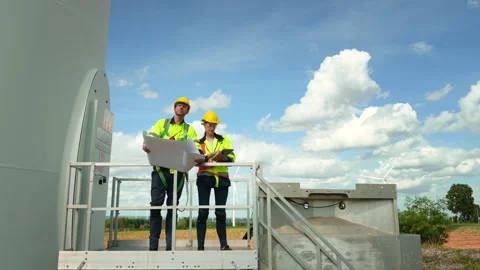 Smart engineer with protective helmet holding the blueprint working at elec.. Stock Footage 269102713