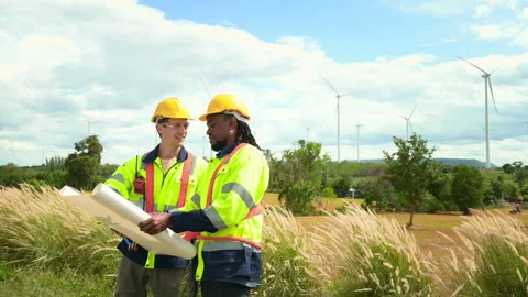 Smart engineer with protective helmet holding the blueprint working at elec.. Stock Footage 269102755