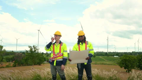 Smart engineer with protective helmet holding the blueprint working at elec.. Stock Footage 269102990