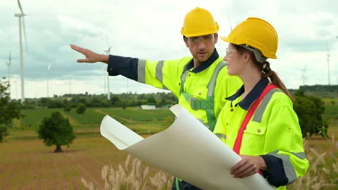 Smart engineer with protective helmet holding the blueprint working at elec.. Stock Footage 269103043