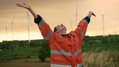 Smart engineer with protective helmet rising hands up  at electrical turbin.. Stock Footage 269100809