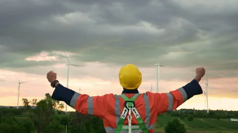 Smart engineer with protective helmet rising hands up  at electrical turbin.. Stock Footage 269100936