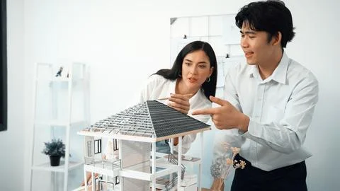 Smart engineer team focusing on checking the house model structure. Immaculate. Stock Photos