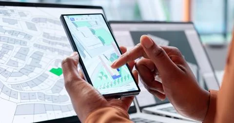 Smart Engineer Uses Phone To View Property Mapping For Real Estate. Stock Photos