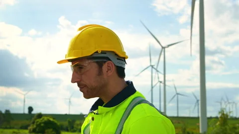 Smart engineer wearing protective helmet drinking water while  working at e.. Stock Footage 269097990