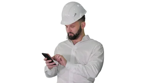 Smart engineer in white shirt and safety engineering hat using smartphone on Stock Footage 146037524