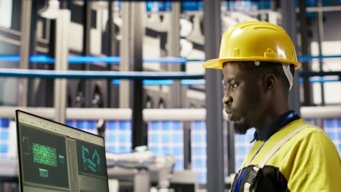 Smart factory employee typing on PC keyboard, testing automated systems Stock Footage 308718847